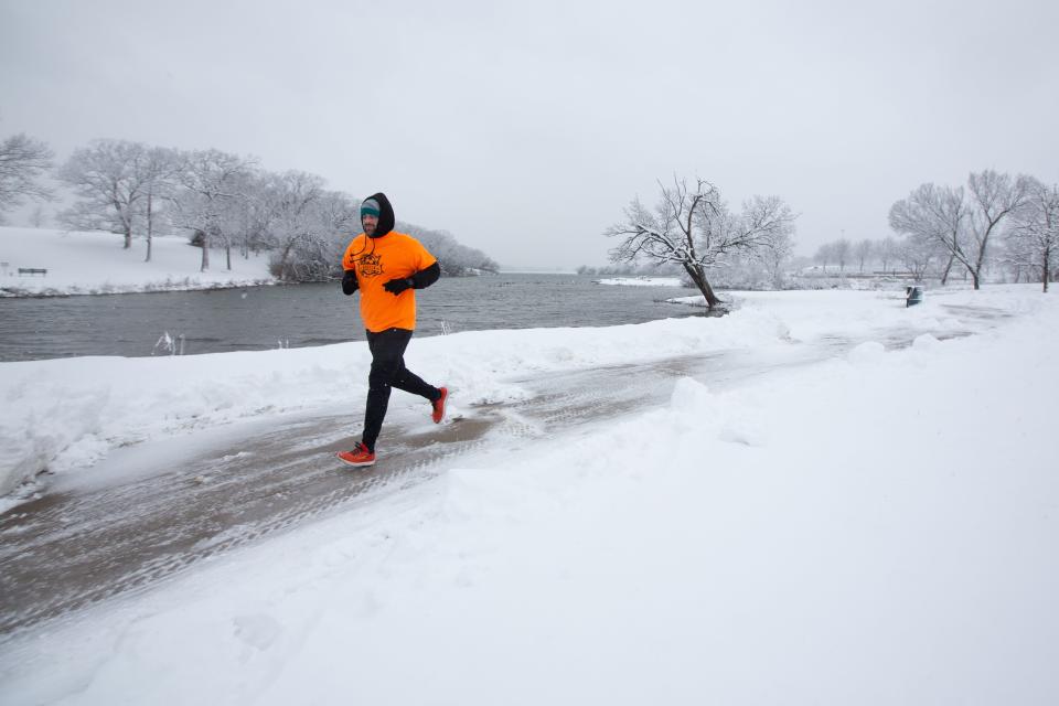 The anticipated sub-zero temperatures and 3 inches of snow didn't stop Shawnee County employee Derrick Mead from getting his steps in Tuesday morning before working from home the rest of the day. City, county and KDOT crews could be seen clearing streets and sidewalks late Monday through Tuesday morning.