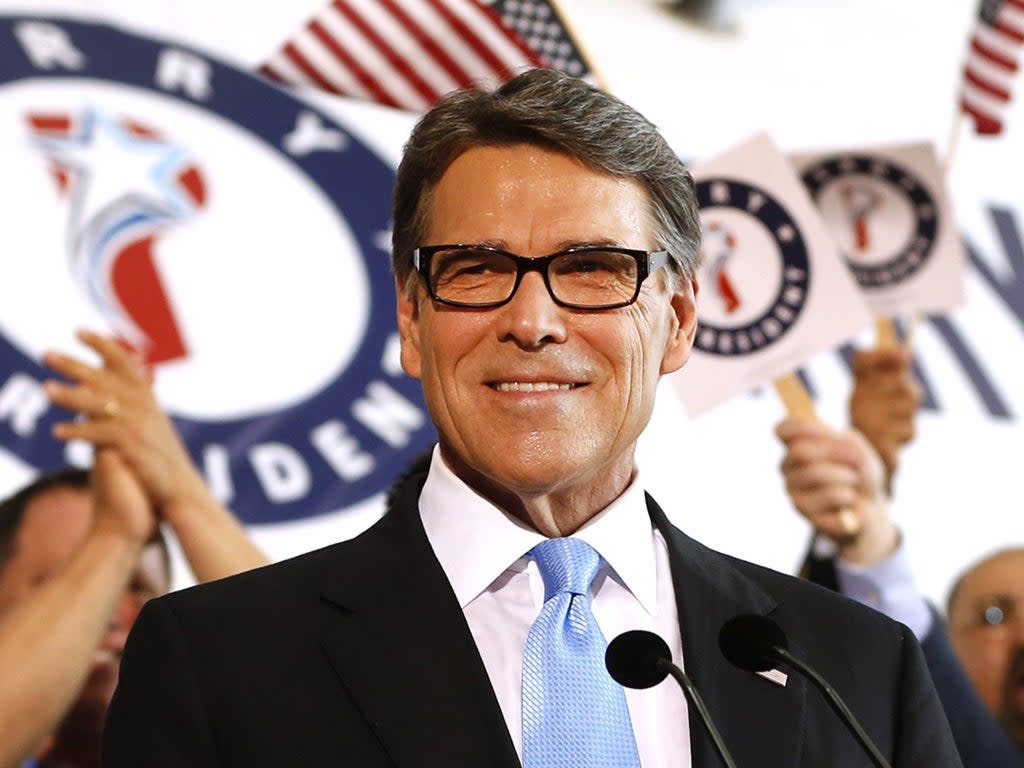 Former Texas Governor Rick Perry smiles after announcing that he will run for president in 2016, 4 June 2015 in Dallas, Texas (Ron Jenkins/Getty Images)