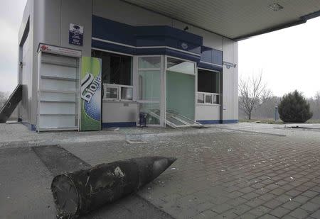 A part of ammunition is seen scattered at a petrol station after ammunition detonated at a military base in the town of Balaklia (Balakleya), Kharkiv region, Ukraine, March 23, 2017. REUTERS/Stanislav Belousov