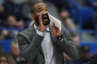 Connecticut associate head coach Kimani Young calls out to players during the second half of an NCAA college basketball game against Villanova, Tuesday, Feb. 22, 2022, in Hartford, Conn. (AP Photo/Jessica Hill)