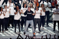 <p>Logic, center, performs during the VMAs. (Photo: Frederick M. Brown/Getty Images) </p>