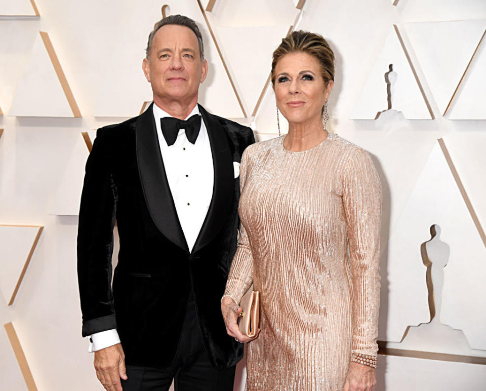 Tom Hanks and his wife Rita Wilson suffered different symptoms, pictured at the Academy Awards, February 2020. (Getty Images)