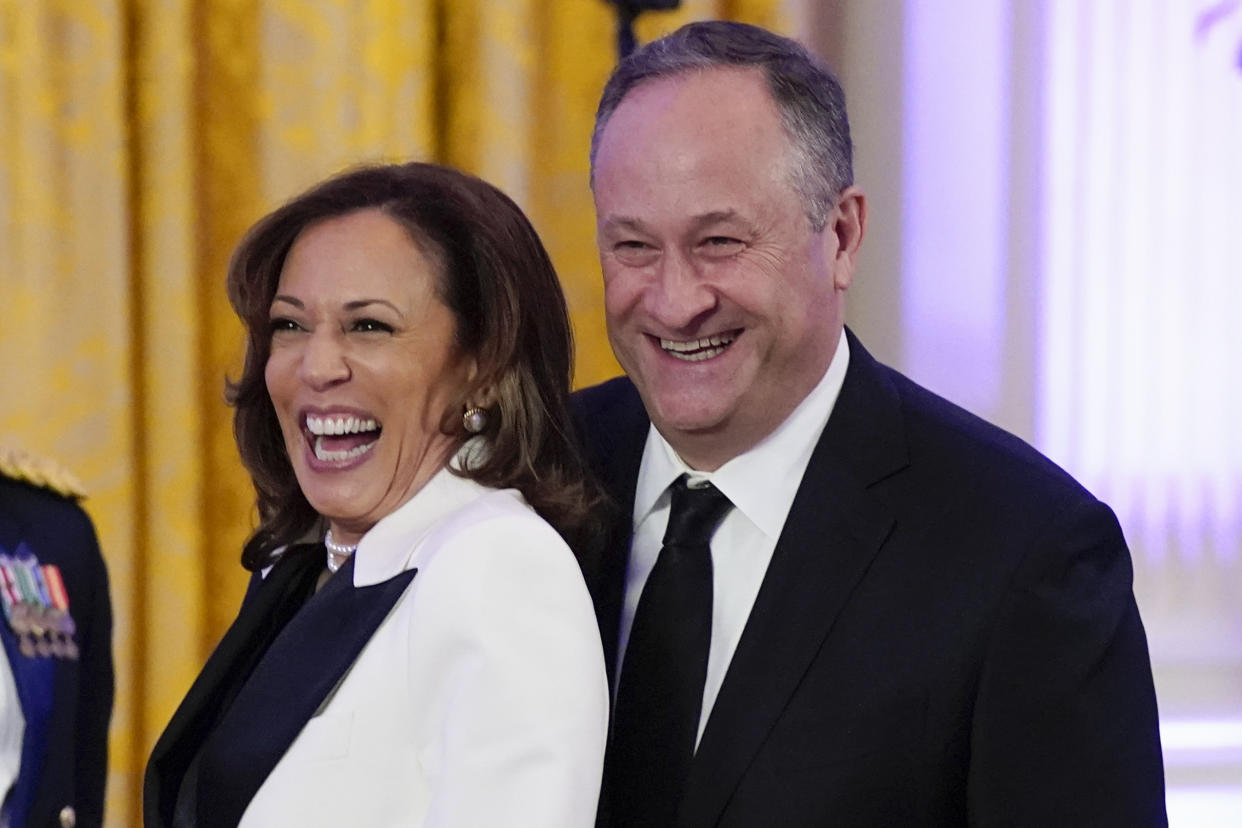 Vice President Kamala Harris and her husband Doug Emhoff arrive in the East Room of the White House following a dinner reception for the governors and their spouses, Saturday, Feb. 11, 2023, in Washington. (AP Photo/Manuel Balce Ceneta)