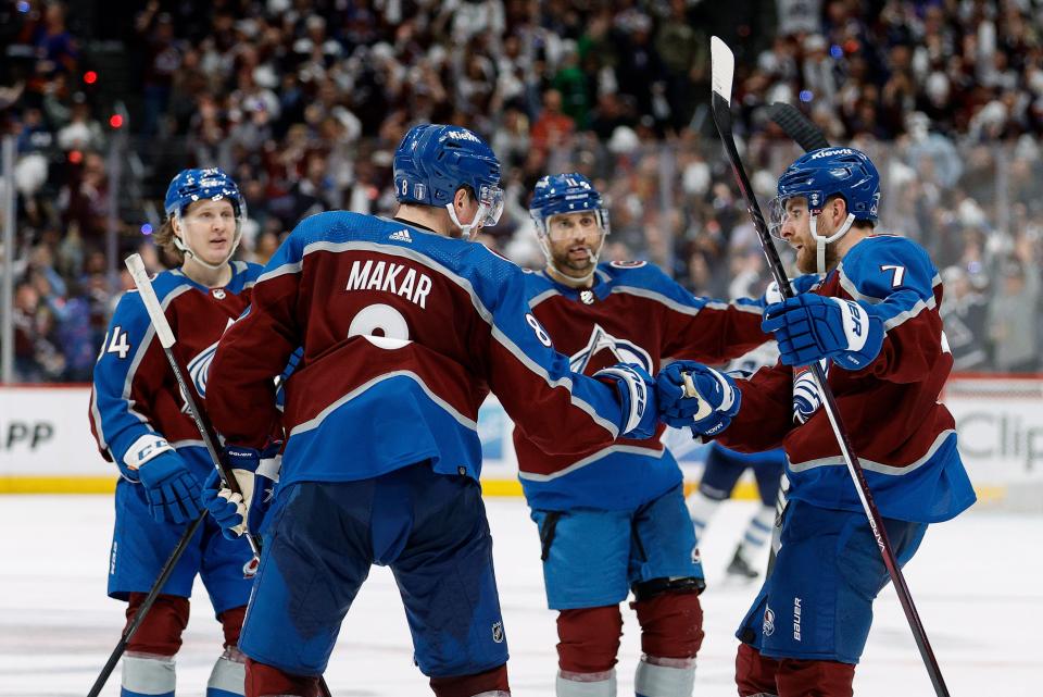 Colorado Avalanche defenseman Devon Toews (7) celebrates his goal with defenseman Cale Makar (8) and center Andrew Cogliano (11) and left wing Joel Kiviranta (94) in the third period against the Winnipeg Jets in game three of the first round of the 2024 Stanley Cup Playoffs at Ball Arena.