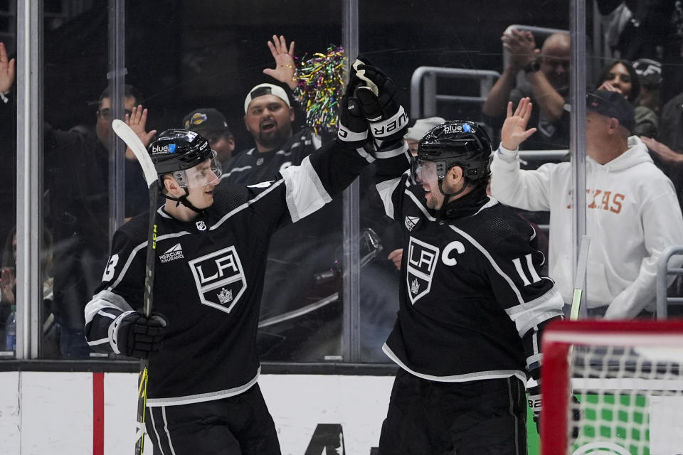 Los Angeles Kings center Anze Kopitar, right, celebrates his goal against the Chicago Blackhawks with defenseman Jacob Moverare during the second period of an NHL hockey game Tuesday, March 19, 2024, in Los Angeles. (AP Photo/Ryan Sun)