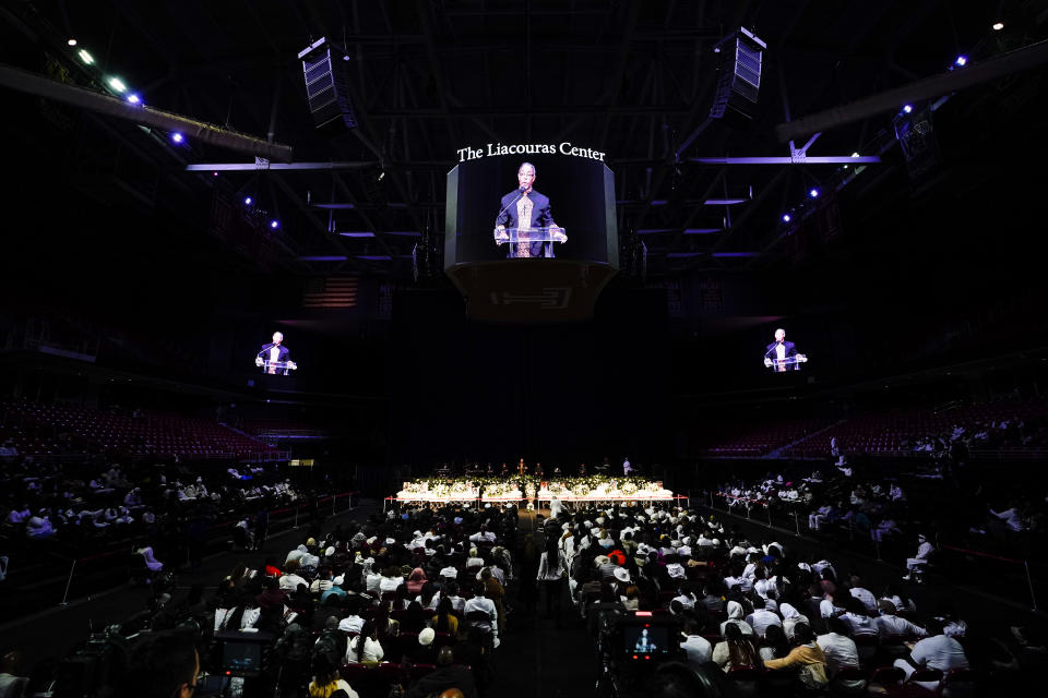 The Reverend Dr. Alyn Waller, at podium, speaks during funeral services for the victims of a deadly row house fire, at Temple University in Philadelphia, Monday, Jan. 17, 2022. Officials say it was the city's deadliest single fire in at least a century. (AP Photo/Matt Rourke)