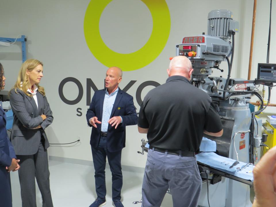 Vice president of manufacturing Gary Thomas speaks as Rep. Mikie Sherrill, left, tours Onkos Surgical, which develops and manufactures treatments for musculoskeletal cancer and complex orthopedic conditions. Onkos recently expanded their R&D facility in Parsippany in order to move the manufacturing of their new prosthesis from overseas to New Jersey.