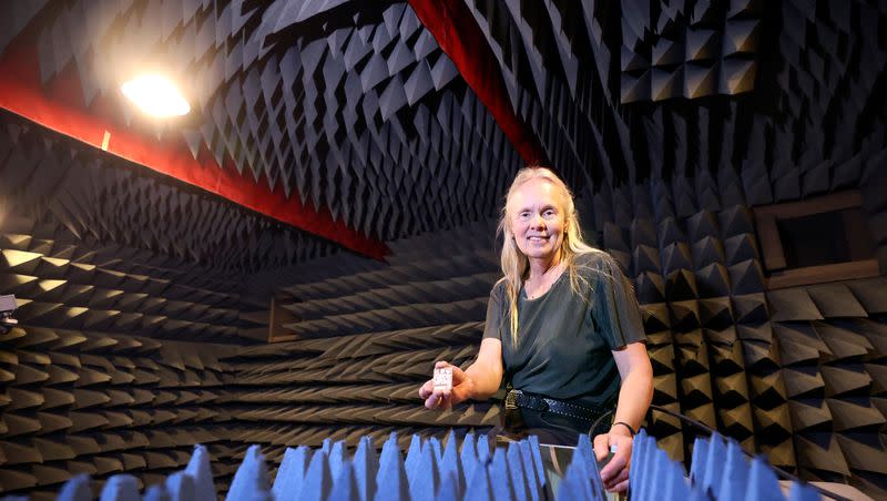 University of Utah Electrical and Computer Engineering Department professor Cynthia Furse holds an antenna while posing for a portrait in an anechoic chamber, where antennas are tested, in the Antenna Measurement Lab at the University of Utah in Salt Lake City on Tuesday, May 23, 2023. Furse says artificial intelligence has been used to develop antennas for decades.