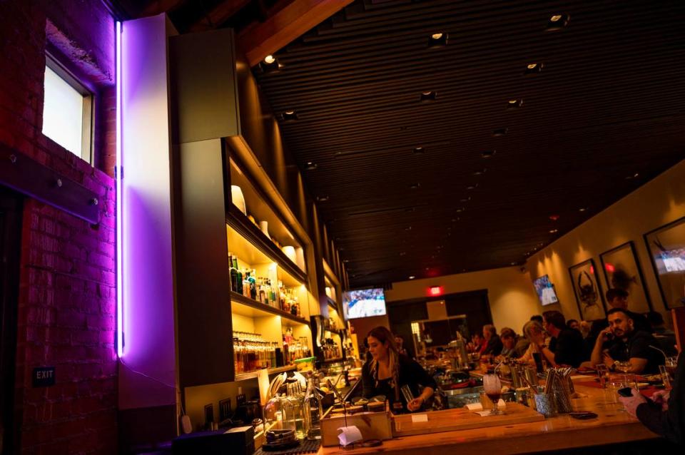 Kru’s purple beam glows near the bar of the East Sacramento sushi restaurant during a brief demonstration on Wednesday.