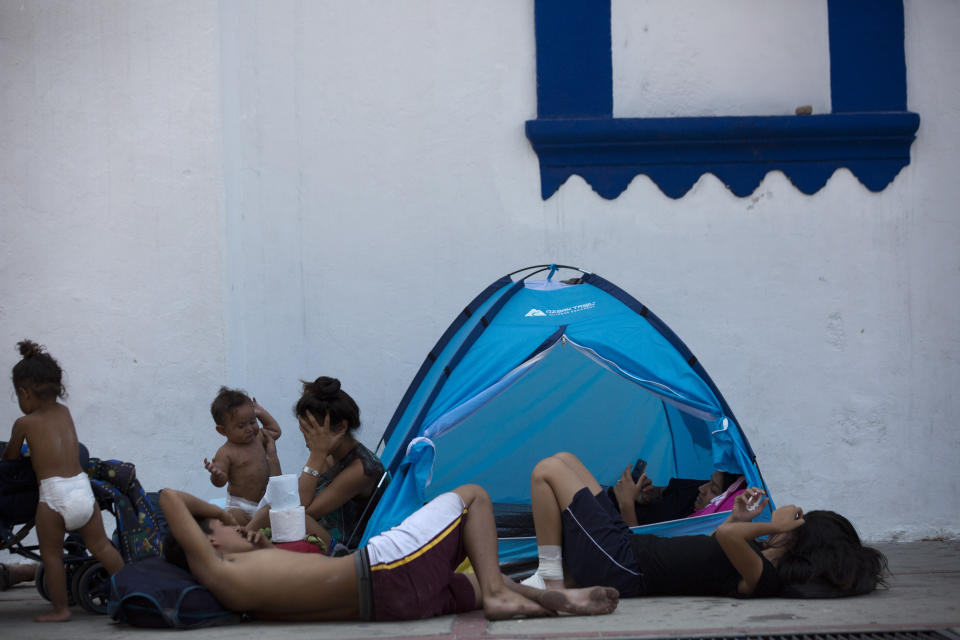 Central American migrants traveling in a caravan to the U.S. rest in the San Francisco Catholic church in Tonala, Chiapas State, Mexico, Tuesday, April 23, 2019. Central American migrants traveling through southern Mexico toward the U.S. on Tuesday fearfully recalled their frantic escape from police the previous day, scuttling under barbed wire fences into pastures and then spending the night in the woods after hundreds were detained in a raid. (AP Photo/Moises Castillo)