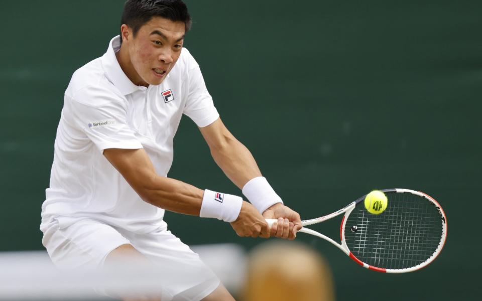 Brandon Nakashima of the USA in action against Daniel Elahi Galan of Colombia during their Men's third round match at the Wimbledon Championships, in Wimbledon, Britain - Tolga Akmen/Shutterstock