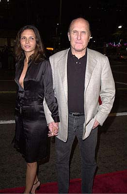 Robert Duvall and woman at the Mann's National Theater premiere of Columbia's The 6th Day