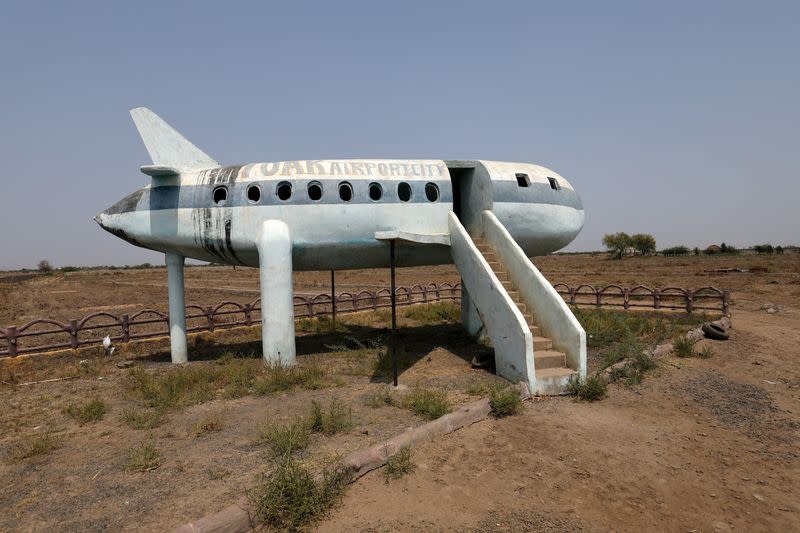 FILE PHOTO: An aircraft shaped Land developer's office is seen near the construction site for the Dholera International airport, in Dholera