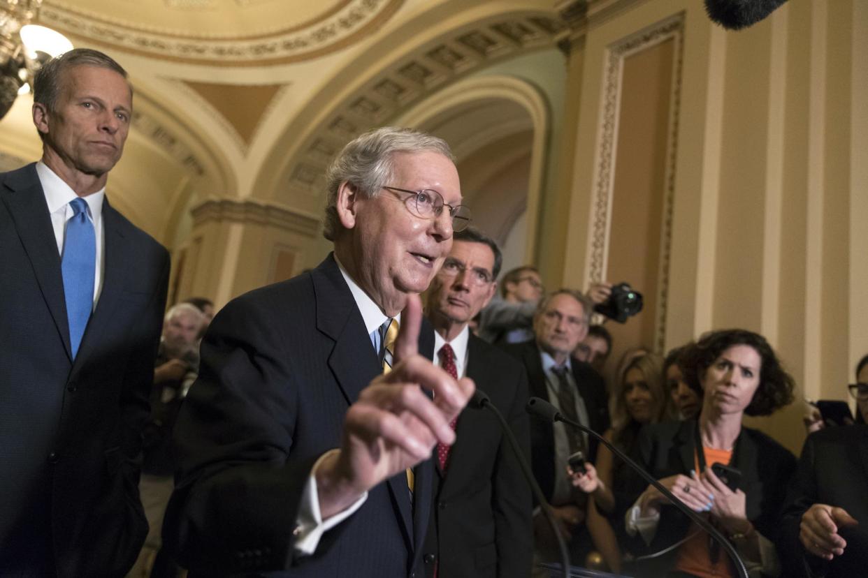 Senate Majority Leader Mitch McConnell flanked by Senator John Thune: AP