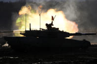 Japanese Ground-Self Defense Force (JGDDF) Type 90 tanks participate in a live-fire annual exercise at the Minami Eniwa Camp Monday, Dec. 6, 2021, in Eniwa, on the northern Japan island of Hokkaido. Dozens of tanks are rolling over the next two weeks on Hokkaido, a main military stronghold for a country with perhaps the world's most little known yet powerful army. (AP Photo/Eugene Hoshiko)