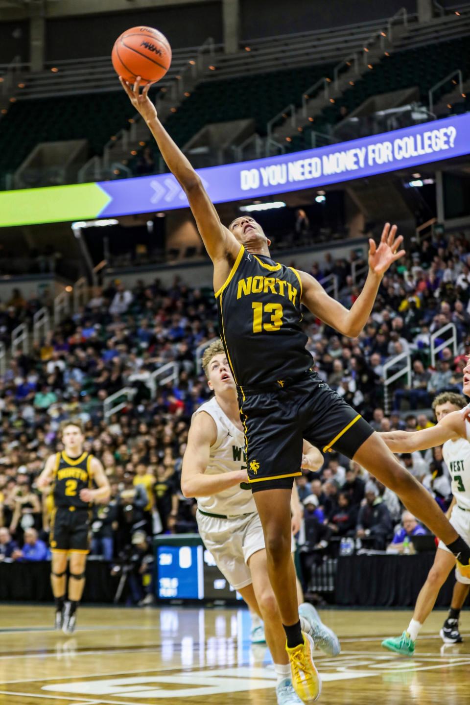 North Farmington’s Dylan Smith gets the rebound and scores against Zeeland West during North Farmington's 58-39 win in the MHSAA Division 1 boys basketball semifinals on Friday, March 15, 2024, at Breslin Center.