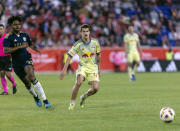 New York Red Bulls defender John Tolkin, front right, passes the ball during an MLS soccer match against the Vancouver Whitecaps, Saturday, April 27, 2024, in Harrison, N.J. (AP Photo/Stefan Jeremiah)