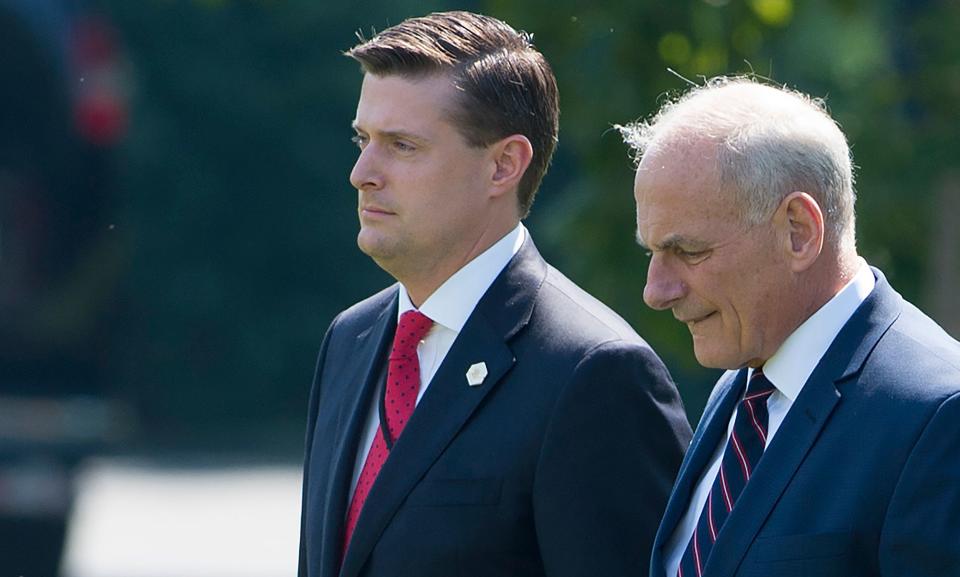 Rob Porter (left) lost his job as White House staff secretary after domestic violence accusations became public. (Photo: Saul Loeb/Getty Images)