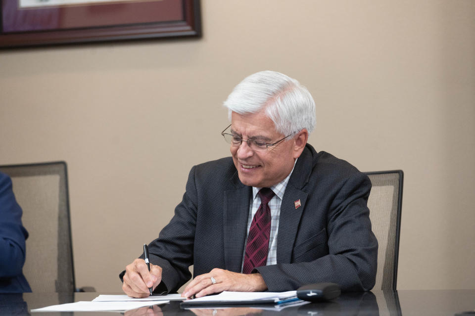 New Mexico State University Chancellor Dan Arvizu signs an memorandum of understanding with the U.S. Department of Fish and Wildlife and the University of Texas at San Antonio. April 11, 2022.