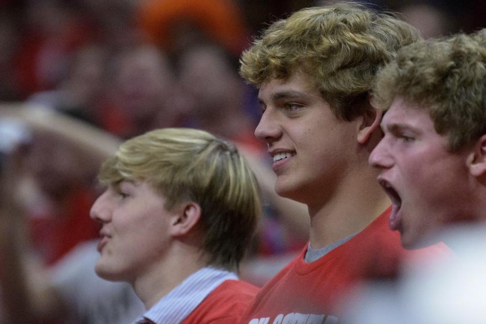 Arch Manning, center, seen here watching an NBA playoff game between the New Orleans Pelicans and Phoenix Suns, is the nephew of former NFL quarterbacks Peyton and Eli Manning and also the No. 1 football recruit in the Class of 2023. Already there is speculation that he could reap millions of dollars from his name, image and likeness wherever he goes to school.