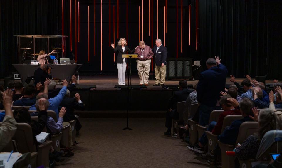 After a vote, with the required majority, Friday, May 6, 2022, Rev. Dr. Carolyn Moore (left) announces Jay Therrell (middle), president of the WCA-Florida, as the new president of Wesleyan Covenant Association. Therrell recently announced he was stepping down as Wesleyan Covenant Association president on Sept. 1, 2023 to take a new position with the Global Methodist Church. A successor hasn't been named yet.