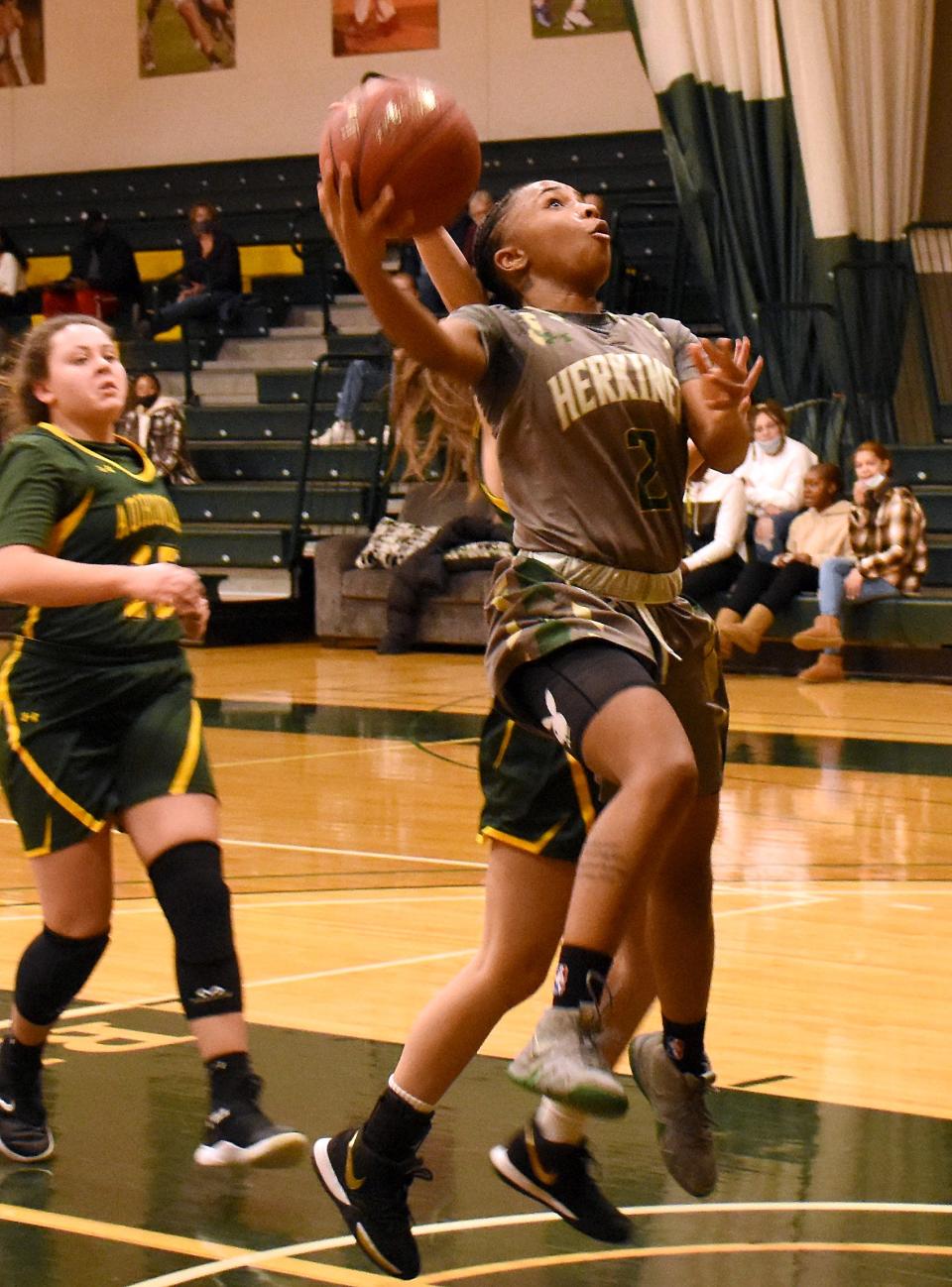 Kapri Bradshaw (2) scores on the break for Herkimer College during the second half against SUNY-Adirondack Wednesday.