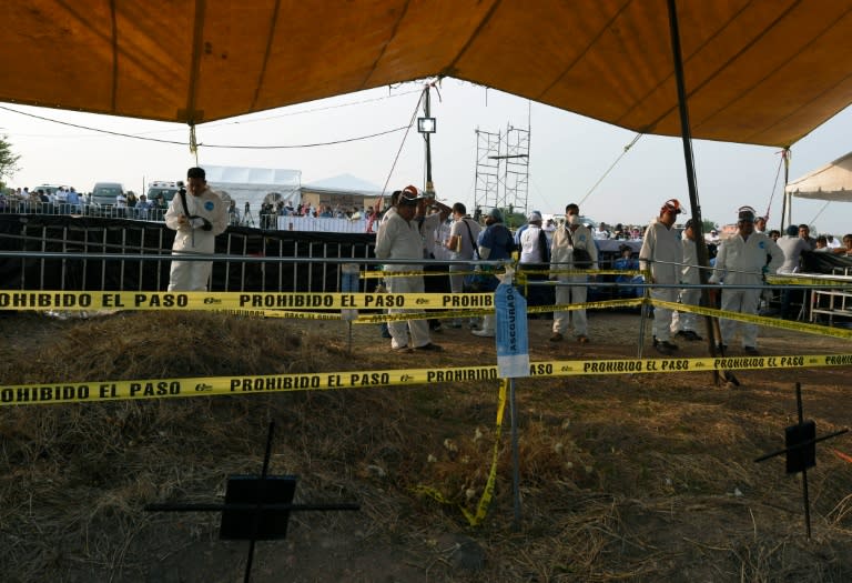 Forensic medical personnel prepare to exhume 116 bodies found in a mass grave at Tetelzingo community in Morelos State, Mexico on May 23, 2016