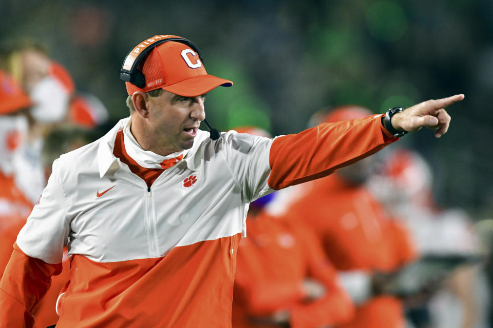 FILE - In this Saturday, Nov. 7, 2020, file photo, Clemson coach Dabo Swinney signals to his players during the second quarter against Notre Dame in an NCAA college football game in South Bend, Ind. The Notre Dame Fighting Irish beat the Clemson Tigers in a thrilling 47-40 shootout earlier this season. The big question now is if they can do it again. (Matt Cashore/Pool Photo via AP, File)