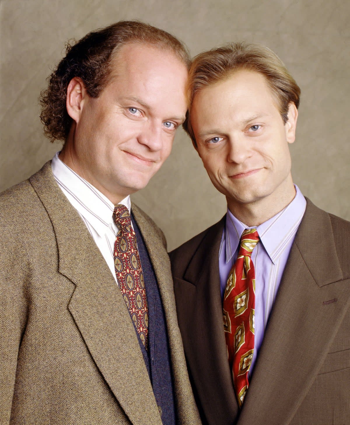 David Hyde Pierce (pictured right) posing next to Kelsey Grammer (right) as Frasier Crane in hit 90s sitcom Frasier (Handout)