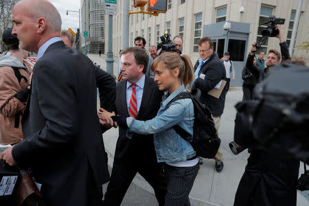 Actress Allison Mack, known for her role in the TV series "Smallville", departs after being granted bail following being charged with sex trafficking and conspiracy in New York, U.S., April 24, 2018. REUTERS/Lucas Jackson