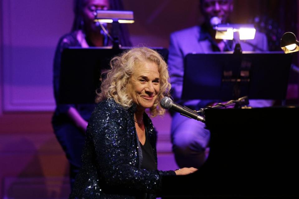 FILE - In this May 21, 2013 file photo, singer-songwriter Carole King, performs during an event to honor her with the Gershwin Prize for Popular Song, at the Library of Congress, in Washington.King is the 2014 MusiCares person of the year being honored on Friday, Jan. 24, 2014, in Los Angeles. The Dixie Chicks, Lady Gaga, Bette Midler and James Taylor are scheduled to perform. (AP Photo/Alex Brandon, File)