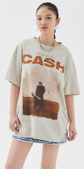 model wearing tan t-shirt with photo of Johnny Cash