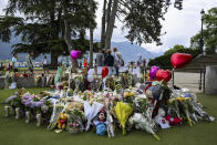 Flowers are laid down at a children's playground in Annecy, France, Saturday, June 10, 2023 following a knife attack on Thursday, June 8, 2023. French judges have handed preliminary charges of attempted murder to a man suspected of stabbing four young children and two adults in a French Alps park. The suspect is a 31-year-old Syrian refugee with permanent residency in Sweden. (Jean-Christophe Bott/Keystone via AP)