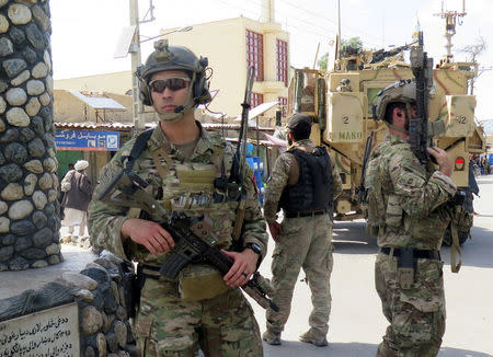 U.S troops keep watch during an official visit in Farah province, Afghanistan May 19, 2018. REUTERS/James Mackenzie