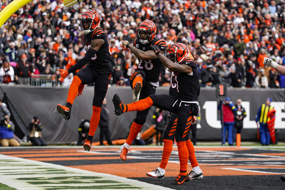 Cincinnati Bengals running back Joe Mixon, center, celebrates a touchdown against the Baltimore Ravens in the first half of an NFL football game in Cincinnati, Sunday, Jan. 8, 2023. (AP Photo/Jeff Dean)