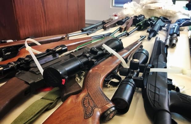 Guns are shown in this file photo from a weapons seizure in 2018. Police say a large number of illegal weapons on B.C. streets are purchased within Canada.