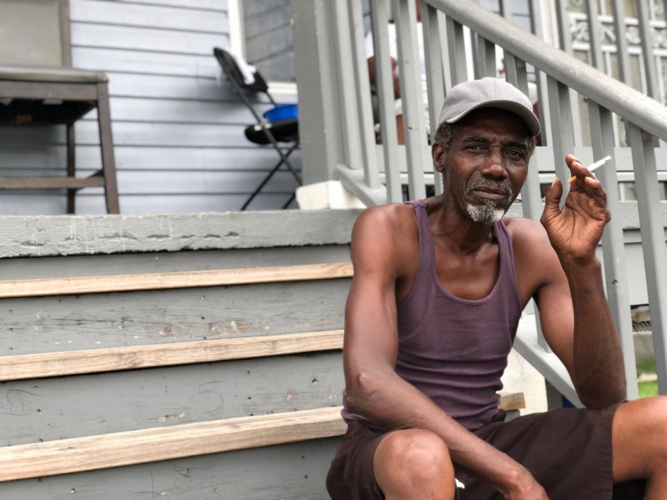 Webster Rainy, 68, was rescued by helicopter from a rooftop in New Orleans' Lower 9th Ward after Hurricane Katrina in 2005. He's not evacuating for storms Laura or Marco, saying he's more confident in nearby levees and floodwalls.