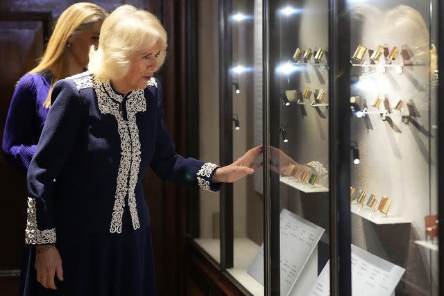 <p>KIRSTY WIGGLESWORTH/POOL/AFP via Getty Images</p> Queen Camilla at the Windsor Castle reception for the new Miniature Library collection on Jan. 30.