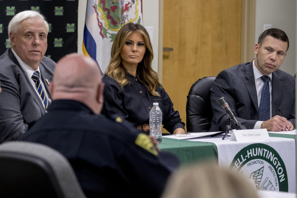 West Virginia Gov. Jim Justice, left, first lady Melania Trump, center, and Acting Homeland Security Secretary Kevin McAleenan, right, listen as Huntington Police Chief Hank Dial, foreground, speaks during a roundtable on the opioid epidemic at Cabell-Huntington Health Center in Huntington, WVa., Monday, July 8, 2019. (AP Photo/Andrew Harnik)