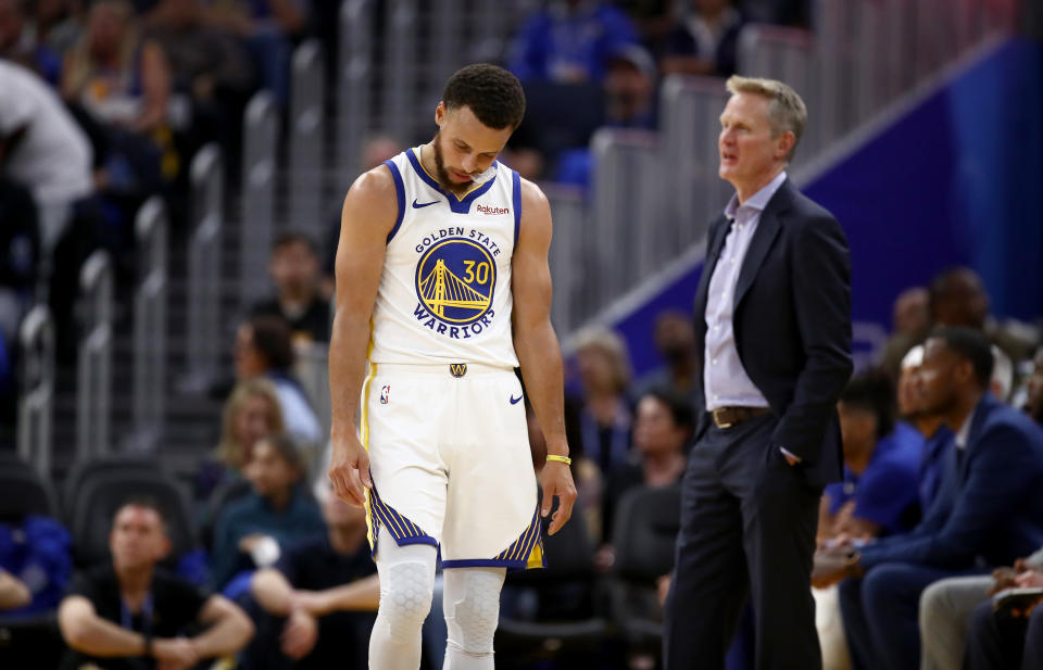 SAN FRANCISCO, CALIFORNIA - OCTOBER 24:   Stephen Curry #30 and head coach Steve Kerr of the Golden State Warriors react after a play during their game against the LA Clippers at Chase Center on October 24, 2019 in San Francisco, California.  NOTE TO USER: User expressly acknowledges and agrees that, by downloading and or using this photograph, User is consenting to the terms and conditions of the Getty Images License Agreement. (Photo by Ezra Shaw/Getty Images)