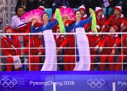 <p>North Korea’s cheerleaders cheer during the women’s preliminary round ice hockey match between Switzerland and the Unified Korean team during the Pyeongchang 2018 Winter Olympic Games at the Kwandong Hockey Centre in Gangneung on February 10, 2018. </p>