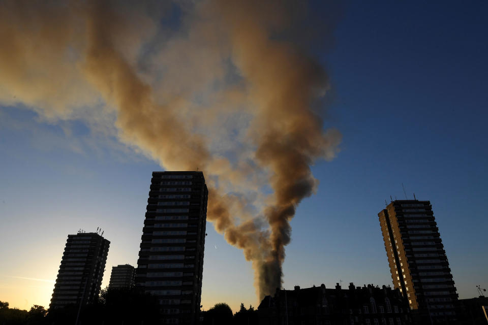 <p>Smoke billows as firefighters deal with a serious fire in a tower block at Latimer Road in West London, Britain June 14, 2017. 2017. (Toby Melville/Reuters) </p>