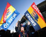 A fan flies the Adelaide Crows flag.