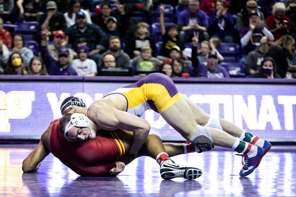 Northern Iowa's Parker Keckeisen, right, wrestles Iowa State's Marcus Coleman at 184 pounds on Feb. 11.