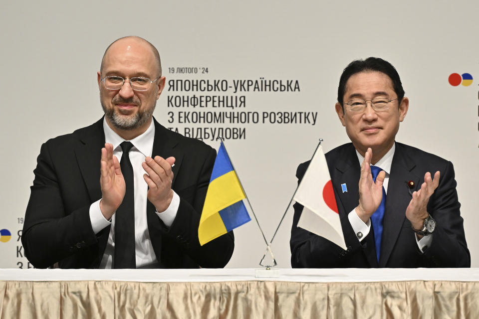 Ukraine's Prime Minister Denys Shmyhal and Japanese Prime Minister Fumio Kishida attend a memorandum of a cooperation exchange ceremony during the Japan-Ukraine Conference for Promotion of Economic Growth and Reconstruction at Keidanren Kaikan building in Tokyo, Monday, Feb. 19, 2024. (Kazuhiro Nogi/Pool Photo via AP)