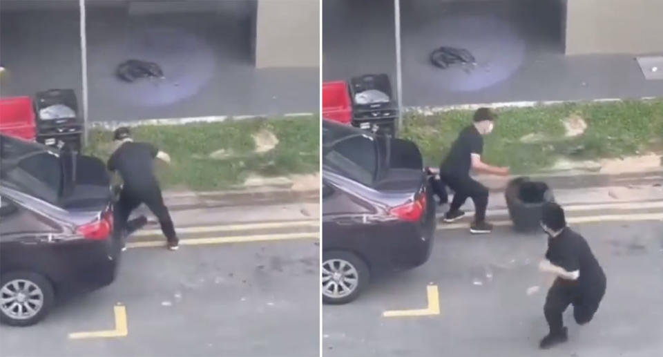 a man stabs a woman behind a parked car as a member of the public throws a rubbish bin at his back.