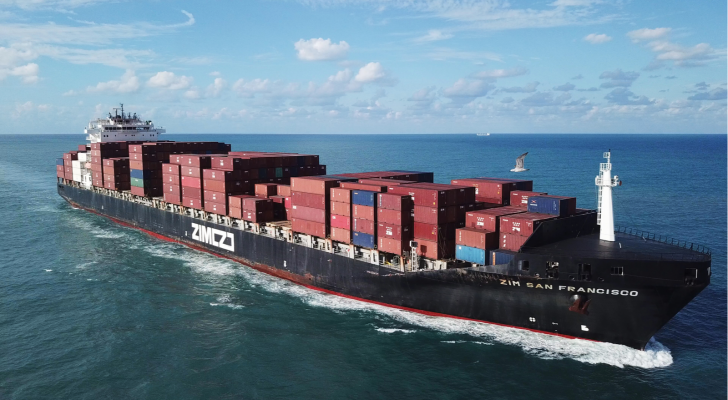 A large ULCV container ship underway, sails on open water fully loaded with containers and cargo - the ZIM San Francisco