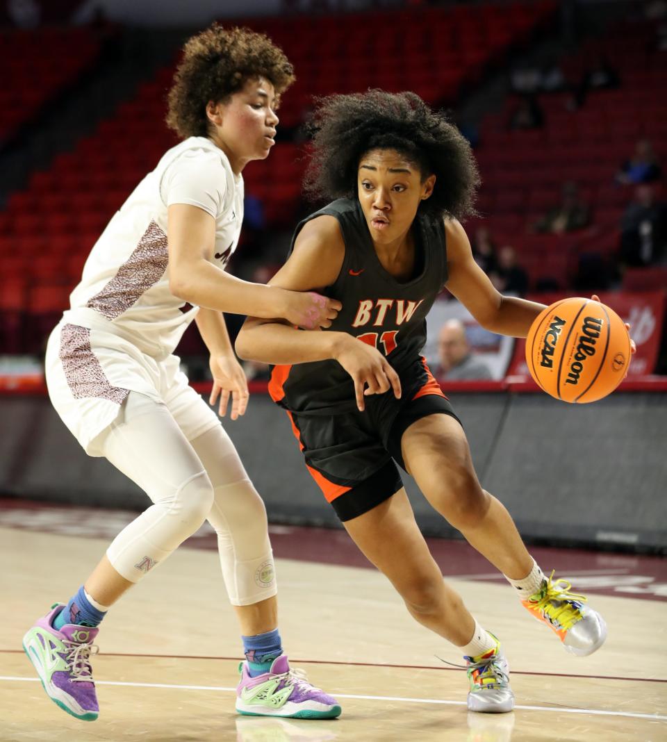 MemorialÕs Janiyah Williams guards Marcayla Johnson as the Edmond Memorial Lady Bulldogs play the Booker T. Washington Lady Hornets during the Class 6A Girls State Basketball Championship Tournament at the Lloyd Noble Center on March 9, 2023 in Norman, Okla.  [Steve Sisney/For The Oklahoman]