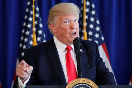 U.S. President Donald Trump delivers remarks before signing the Veterans Affairs Choice and Quality Employment Act at Trump's golf estate in Bedminster, New Jersey, U.S. August 12, 2017. REUTERS/Jonathan Ernst