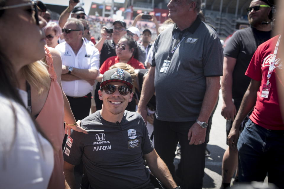 FILE - In this July 14, 2019, file photo, injured driver Robert Wickens is photographed before leading the parade lap in a car fitted with hand controls before the Honda Indy auto race in Toronto. Wickens has been fighting his way back from a spinal cord injury, waiting anxiously to line up on a starting grid and compete against his old racing buddies. On Saturday, April 4, 2020, he wait ends. The promising Canadian driver will make his debut in the IndyCar iRacing Challenge — a virtual race on the Barber Motorsports Park in Alabama that Wickens believes could be the biggest step yet in his recovery. (Tijana Martin/The Canadian Press via AP, File)